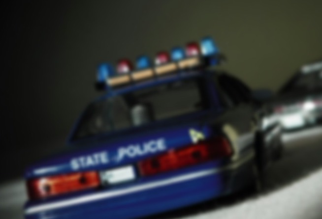 blurry police car pulled over drunk driver