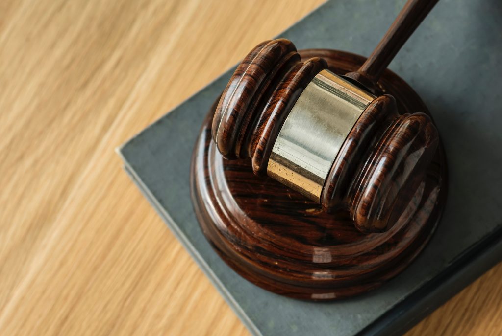 Picture of a gavel in a courtroom.